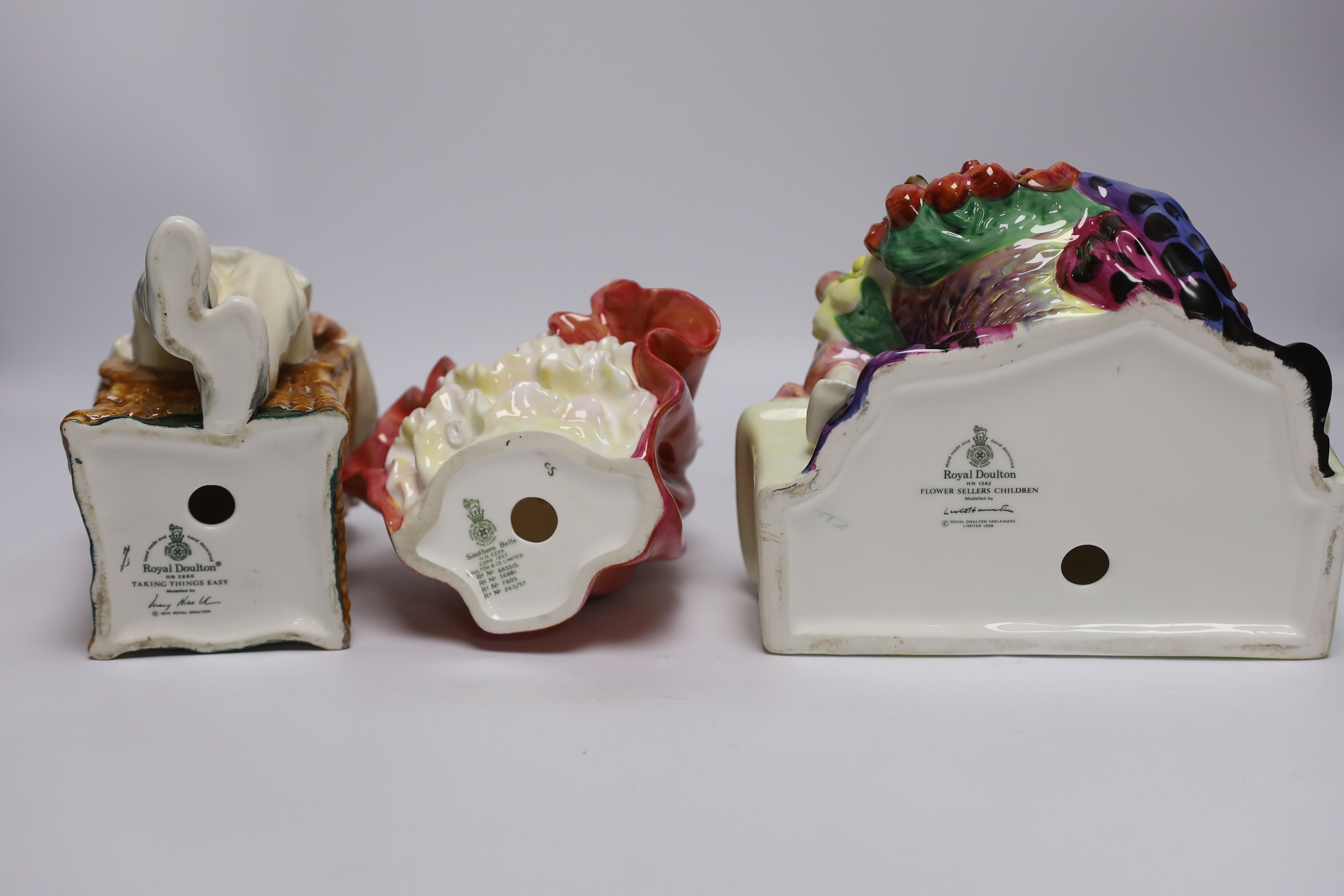 Six various Royal Doulton figures - Southern Belle, Taking Things Easy, Fair Lady, The Laird, Elyse and Flower Sellers Children